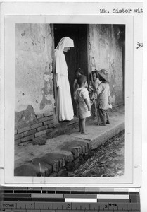 Maryknoll Sister with children at Meixien, China, ca.1940