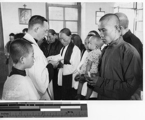 Fr. Escalante baptizing a group in Dalian, China, 1940