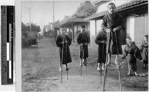 Boys walking on stilts, Japan, ca. 1920-1940