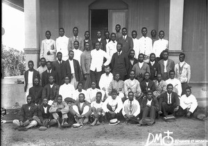 Group of African men in front of a chapel, Maputo, Mozambique, 1905