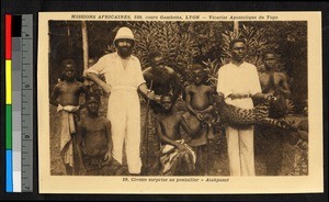 Men posed with hunted animal, Togo, Africa, ca. 1920-1940