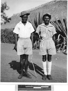 Two men standing next to each other outside, Africa, July 1949