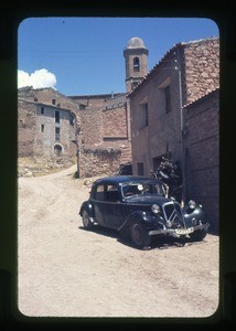 buildings, automobile in the foreground