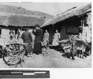 Fr. Geselbracht visiting a village, Fushun , China, 1940