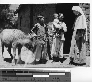 A Maryknoll Sister visits a family at Ngfa, China, 1949