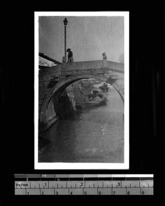 Canal with boats and bridge, between Suzhou and Zangzok, China, ca.1922