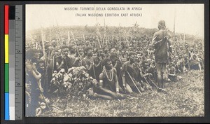 Catechist instructing seated people, Kenya, ca.1920-1940