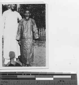 An elderly man makes first confession at Pingnan, China, 1930