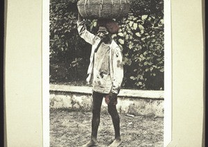 "Cooly with a basket on his head."