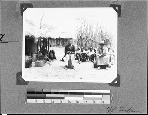 People sitting in front of their huts, Nyasa, Tanzania, 1937