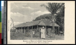 Missionary father with children near a schoolhouse, Mbamou, Congo Republic, ca.1900-1930