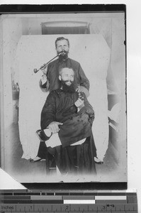 Priests pose with pipes at Yunnan, China