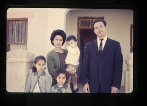 Family outside their home