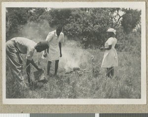 Heating water on safari, Eastern province, Kenya, ca.1949