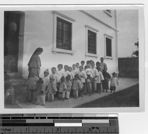 Maryknoll Sisters take orphans for a walk at Luoding, China, 1934