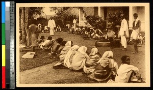 Newly baptized people eating a meal on the ground, Kollam, India, ca.1920-1940