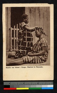 Woman arranging another's hair, Congo, ca.1920-1940