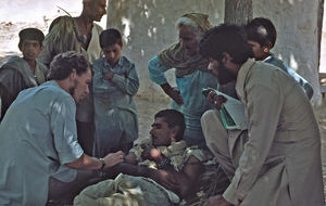 Pakistan, NWFP. Deacon Frede Søndergaard Hansen is assisting a patient at Peshawar. (Anna Birgi