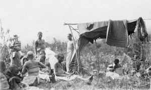 Africans resting beside a field, Tanzania, ca.1893-1920