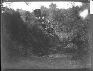 Crossing a river, Mozambique, ca. 1901-1907