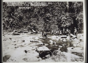 Bakosi people crossing a river en route for the coast (Cameroon)