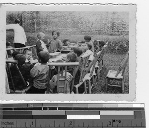 An outdoor supper at the orphanage at Luoding, China