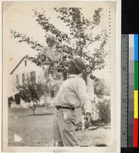 Lorenzo Morgan holding Carrel Morgan with one hand, Haizhou, Jiangsu, China, ca.1918