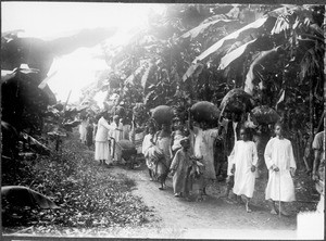 People carrying agricultural products on Thanksgiving Day, Gonja, Tanzania, ca.1911-1914