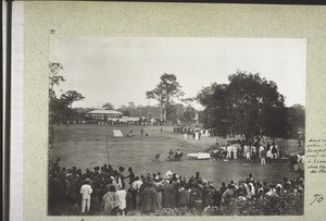 Sports day organised by the British government - to celebrate king Edward's birthday and the anniversary of the liberation of Kumase after the revolt - the rescuing troops arrived on 15 July. All the chiefs were invited to the sports. The Basel Mission trading store in the background