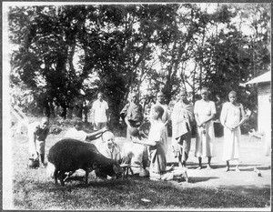 Group portrait of Arnold Blumer and young African people, Arusha, Tanzania, 1927