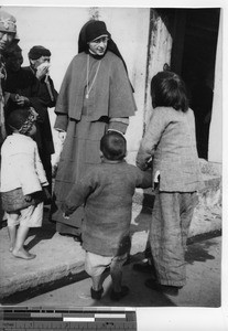Maryknoll Sister with refugees in China