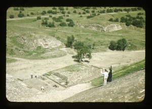 man and woman standing on ruins