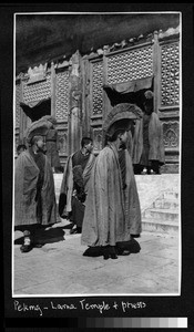 Buddhist priests in front of temple, Beijing, China, ca. 1910-1920