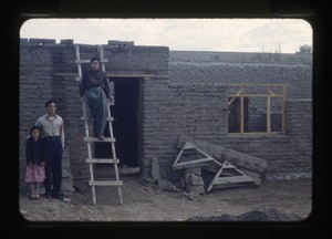 group in front of a building under construction