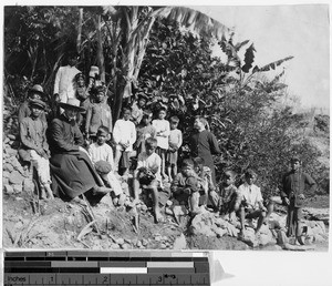 Two Belgian priests and Igorot school boys on a picnic, Philippines, ca. 1900-1920