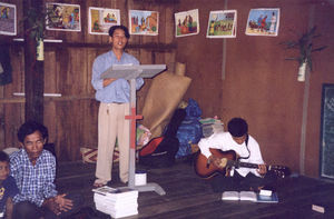 Sophan is leading a congregation. He is one of two students from The Bible School, who are supp