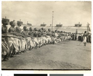 Dancing men in a workers' compound, South Africa