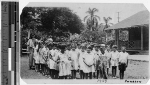 Sister Chanel Xavier, MM, with Maryknoll primary school students, Punahou, Honolulu, Hawaii, 1928