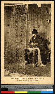 Missionary father repairing fishing nets, Canada, ca.1920-1940