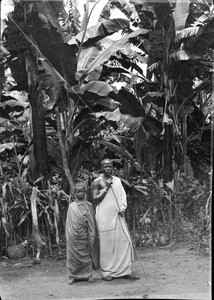 African man and boy in front of banana plants, Tanzania, ca.1893-1920