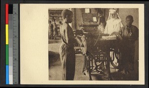 People operating a printing press, Congo, ca.1920-1940