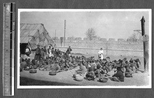 Refugee children receiving food, Jinan, Shandong, China, ca.1928