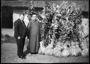 Two men with plants, Chengdu, Sichuan, China, ca.1939