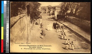 Orphans and nuns walking, India, ca.1920-1940