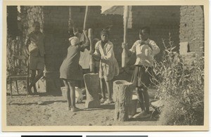 Girls pounding corn, South Africa