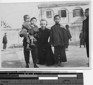 Bro. Michael with children at Hong Kong, China, 1924