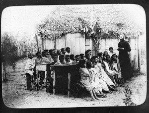 Fr. Anthony Cotta, MM, instructing children, Madagascar, ca. 1898-1905