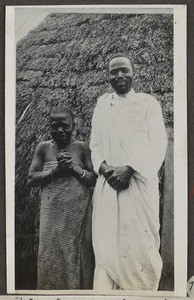 Filipo Ndjau with his mother Maria in front of Chagga hut, Tanzania