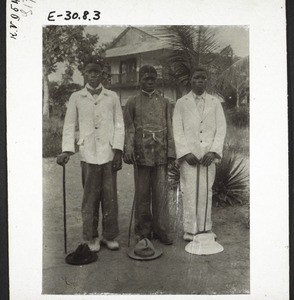 3 young men from Bonaberi in the front of the mission house