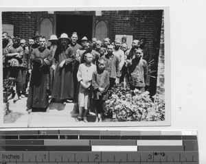 Bishop Deswazieres with lepers at Sheklung, China